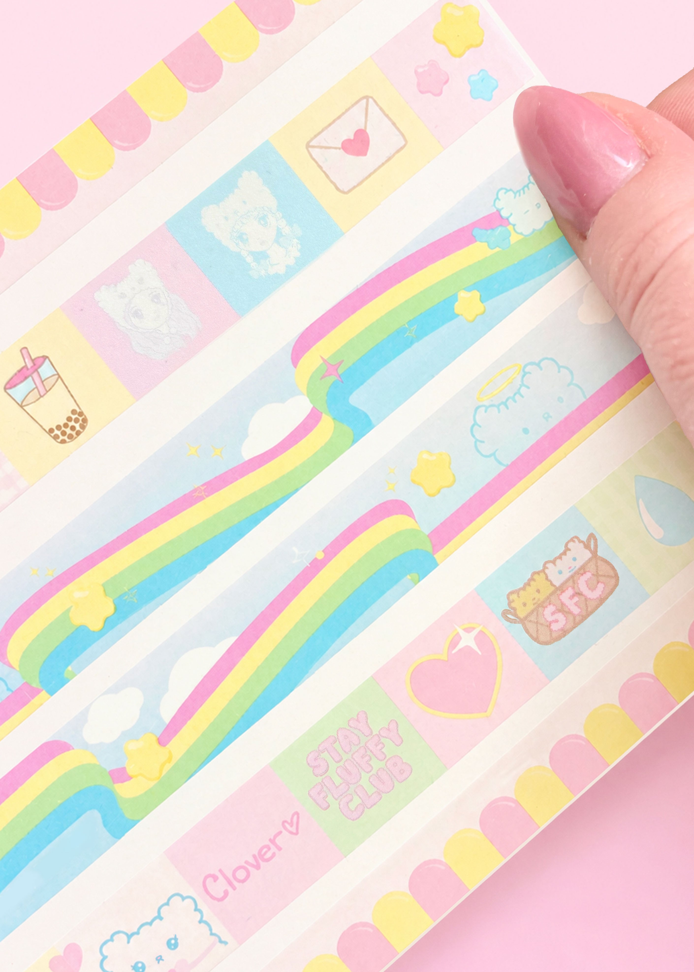 Pastel-colored stationery items with cute designs on a pink background by stay fluffy club